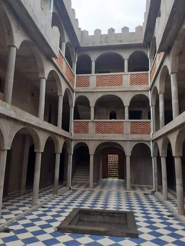 Relais Castle Moroccan β Courtyard with multiple levels of arches, columns and central fountain